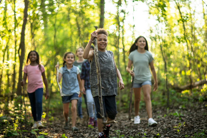 group of children hiking in a park