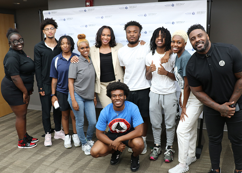 Grand Marshall Jay Barnett poses for a photo with participants at the Youth Summit