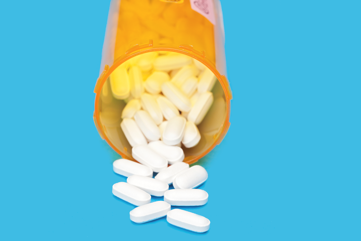 prescription bottle with pills spilling out
