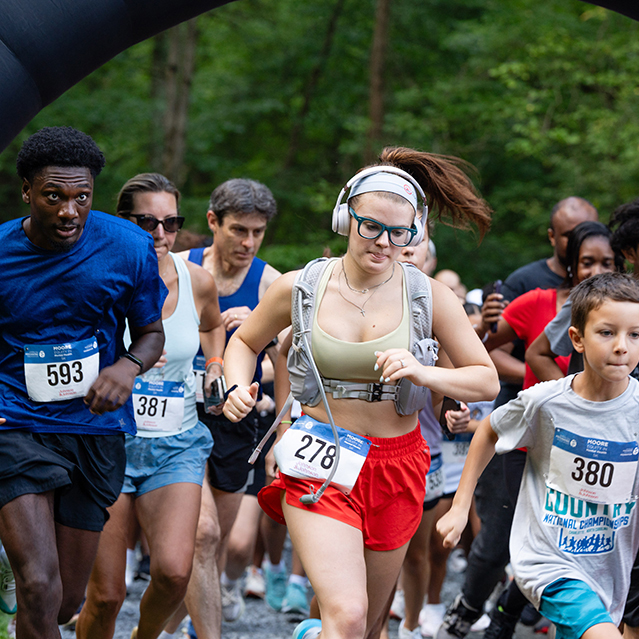 Runners leaving the starting line at the 2025 MOORE Equity in Mental Health 5K