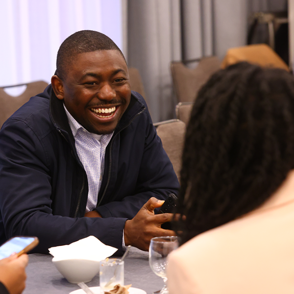 fellows at an annual meeting session having a conversation