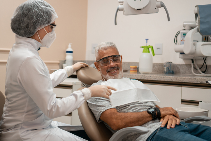 older adult woman receiving dental care