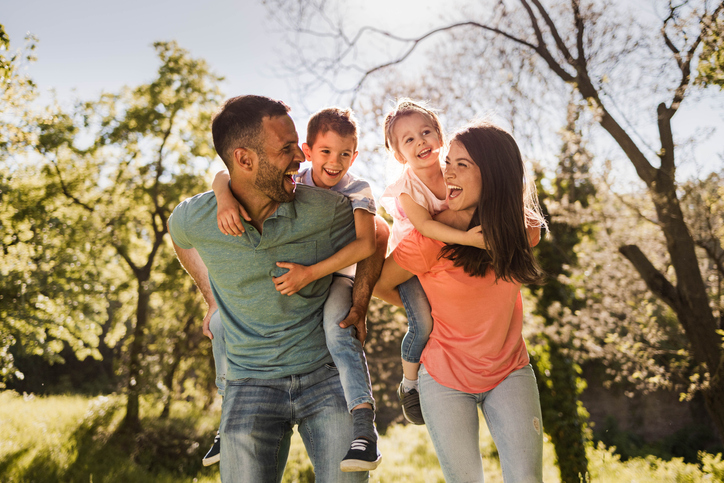 family outdoors in a park