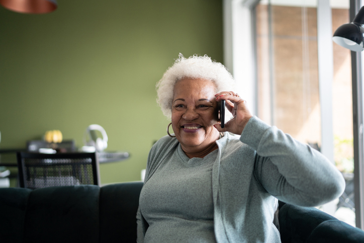 older adult on phone