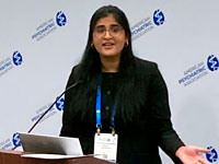 Woman speaking into microphone