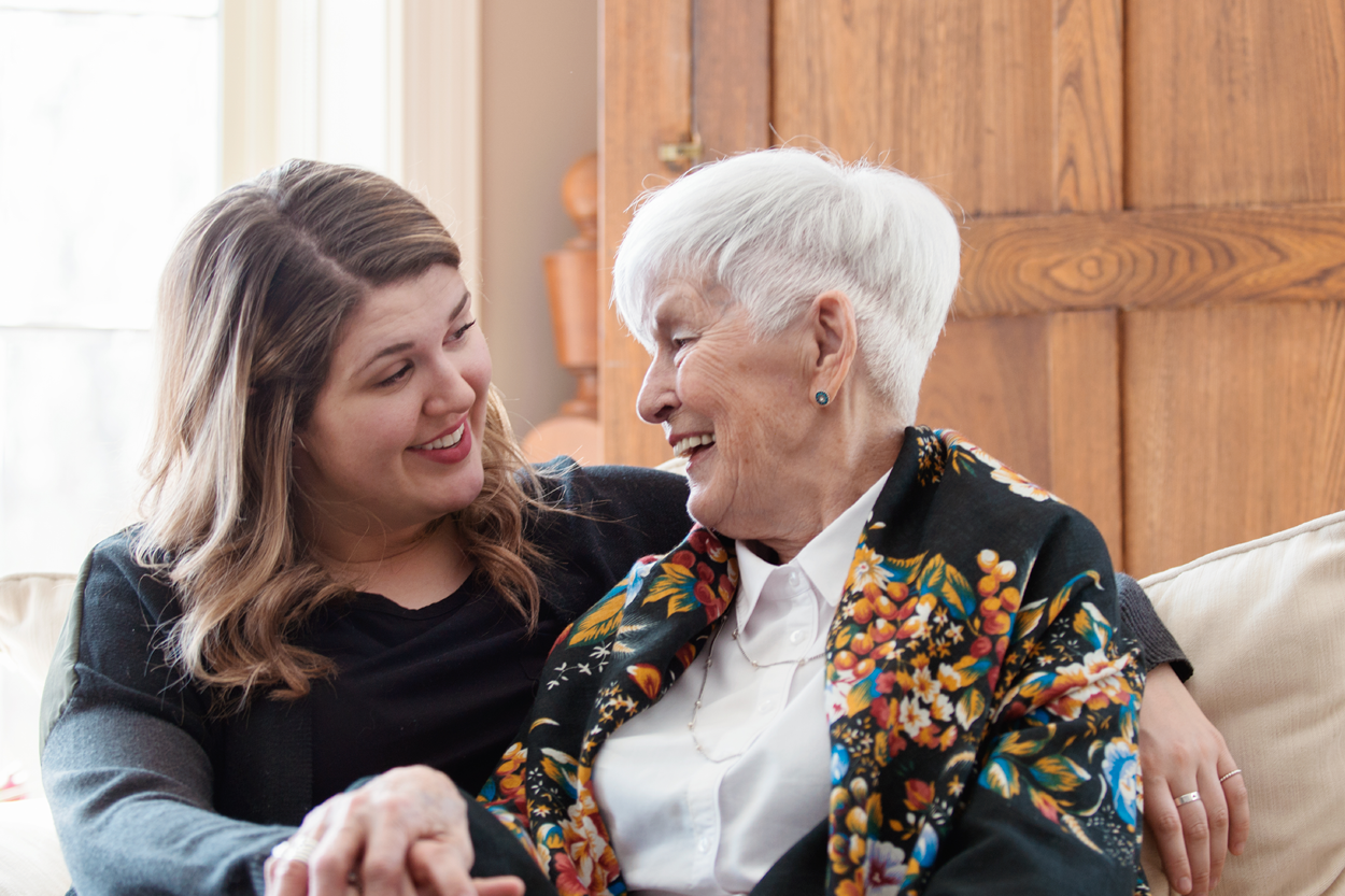 Woman talking to elderly woman