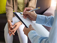 patient and therapist talking