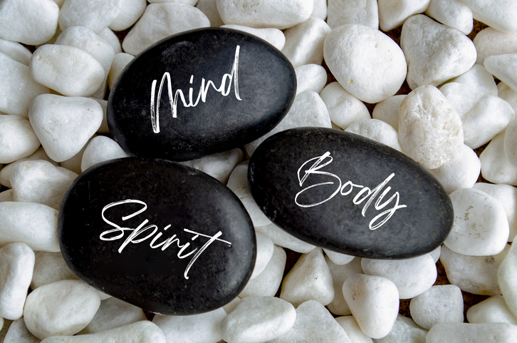 mind, body, spirit written on stones
