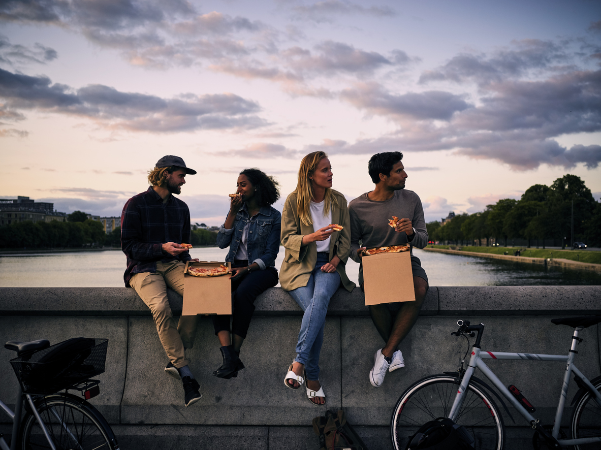 A couple of people that are sitting on a bicycle Description automatically generated