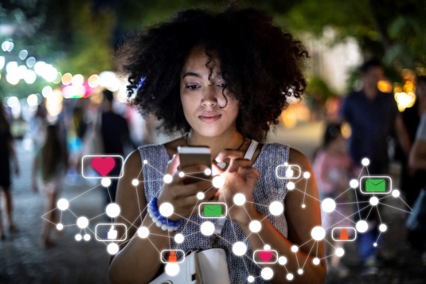 woman holding phone with messages