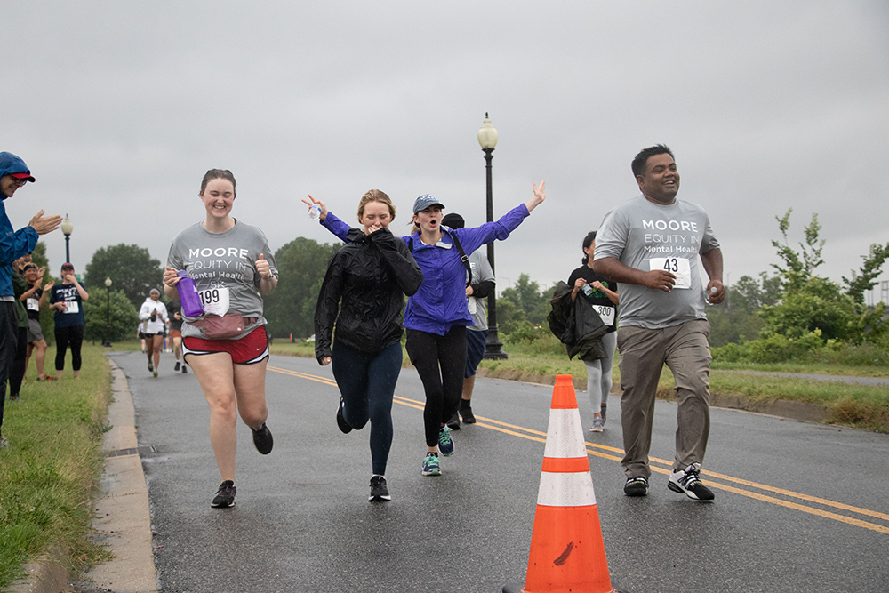 MOORE Equity 5k Runners Crossing Finish