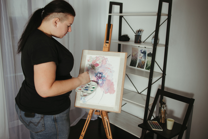 young woman at an art easel