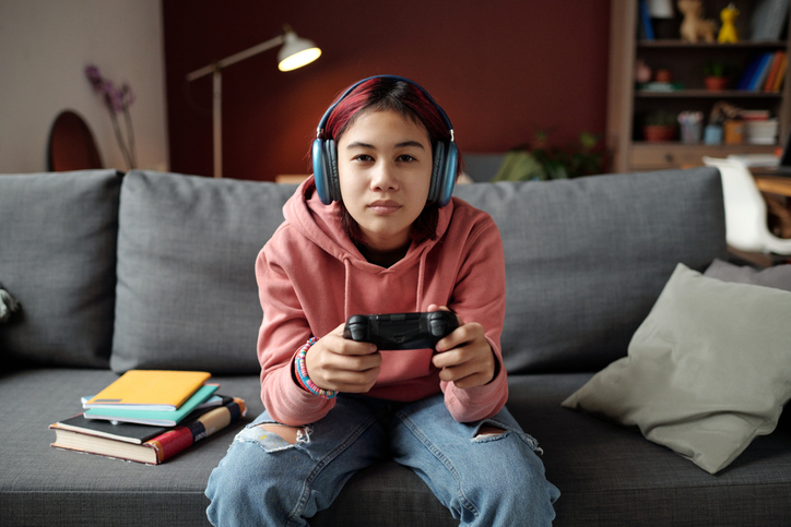 teenager playing video game