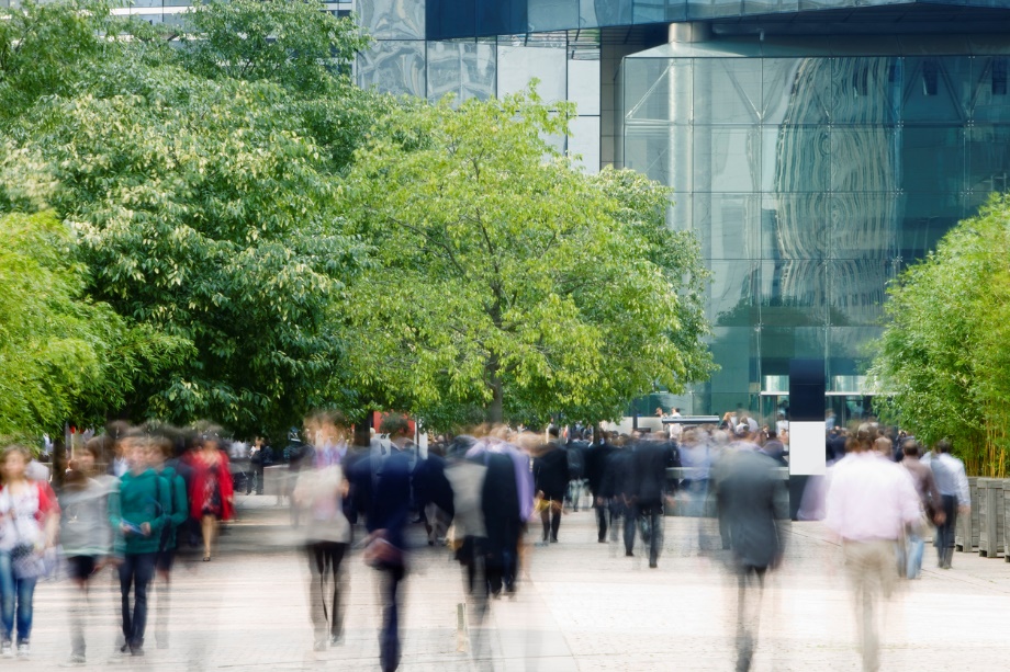 A group of people walking down a street Description automatically generated