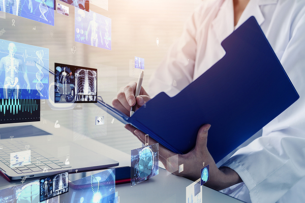 Doctor reviewing digital patient records with medical scans and health data displayed on a computer interface
