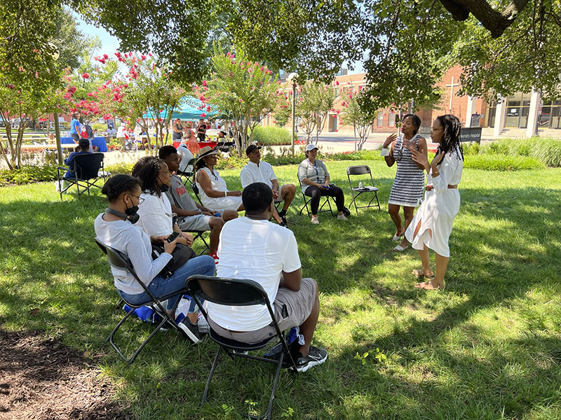 participants having a discussion at the 2022 Moore Equity in Mental Health Community Fair