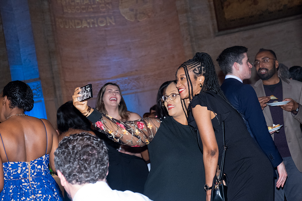Two people taking a selfie at the 2024 APAF Annual Benefit