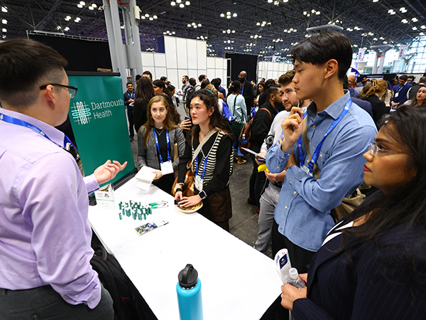2024 Annual Meeting attendees exploring an exhibitor booth