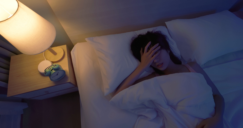 woman sleeping restlessly