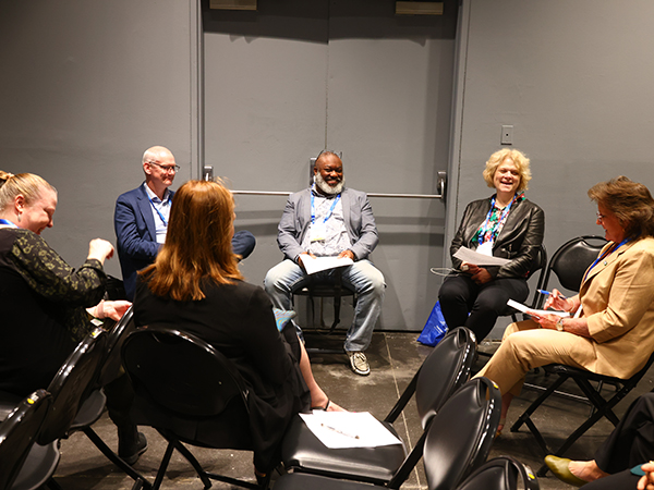 2024 Annual Meeting attendees having a discussion
