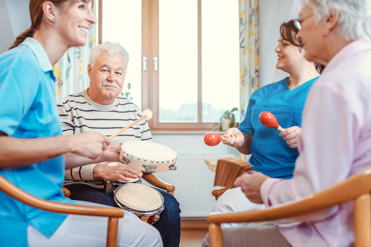 small group of older adults in music therapy