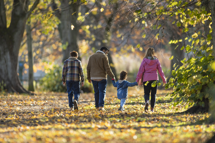 family walking in a park