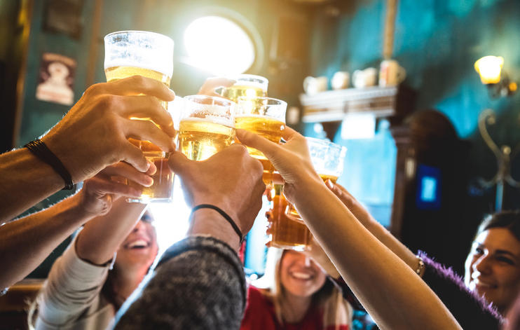 group raising a toast with glasses